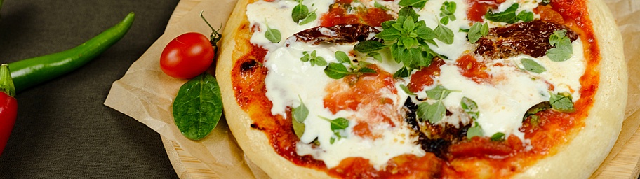 Pizza with burrata cheese, tomatoes, and spicy Kimchi Tamaki