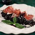 Black pasta with prosciutto, figs and gorgonzola